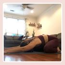 writer performing child's pose at home