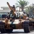 Turkish troops parade atop armoured vehicles in the northern part of Nicosia, the capital of the self-proclaimed Turkish Republic of Northern Cyprus on July 20, 2020, to mark the 46th anniversary of the Turkish invasion in 1974.