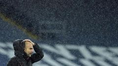 Pep Guardiola is soaked on the sidelines as Storm Bella battered the Etihad during Manchester City's win over Newcastle