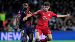 Alex Song (L) playing for Barcelona in a 2013 Champions League semi-final against Bayern Munich.