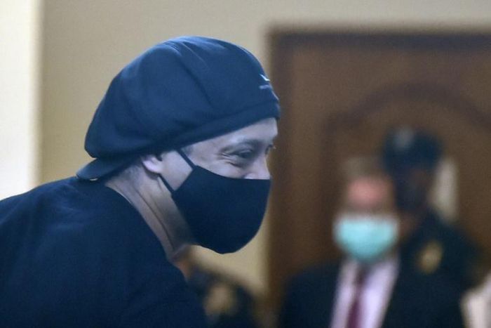 Brazilian retired football player Ronaldinho arriving for his hearing at the Asuncion's Justice Palace, in Asuncion