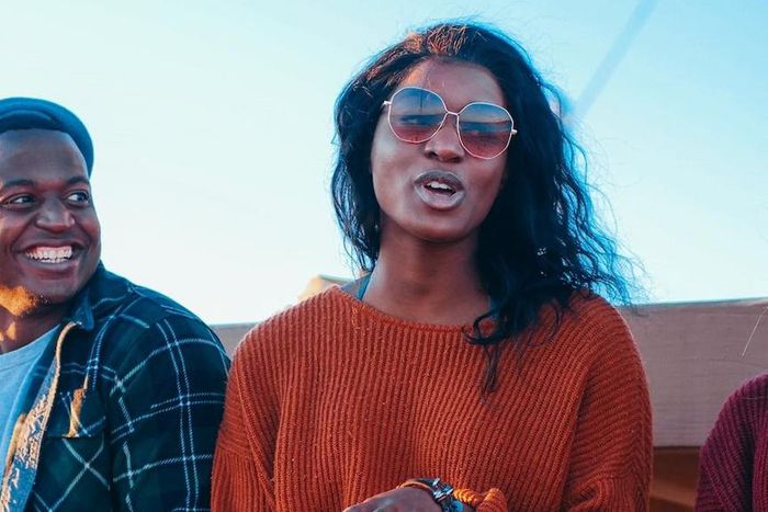 Smiling man looking at a woman who is speaking [Image: Kindel Media]