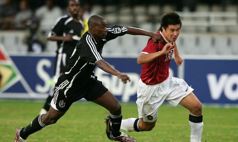 New Chippa United coach Lehlohonolo Seema (L) playing for Orlando Pirates against Manchester United in a tour match