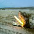 This handout photo provided by Iran's Revolutionary Guard Corps (IRGC) on July 28, 2020 shows rockets being fired from a launch vehicle during a military exercise near the Strait of Hormuz