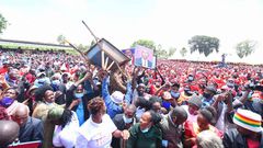 Crowd raises a wheelbarrow during DP William Ruto's Central Kenya tour