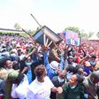 Crowd raises a wheelbarrow during DP William Ruto's Central Kenya tour
