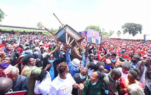 Crowd raises a wheelbarrow during DP William Ruto's Central Kenya tour