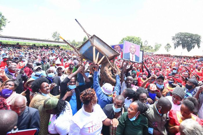 Crowd raises a wheelbarrow during DP William Ruto's Central Kenya tour