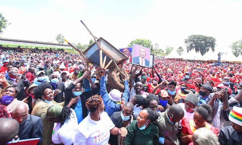 Crowd raises a wheelbarrow during DP William Ruto's Central Kenya tour