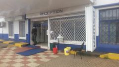 A police officer guards the entrance to Kemsa offices during September 9, 2020 EACC raid