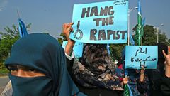 Protests have broken out after a police chief's comments appeared to blame a woman who was gang raped because she was driving without a male companion