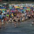 Despite COVID-19 fears, people enjoy warm summer weather at a beach near the Baltic Sea village of Binz, northern Germany