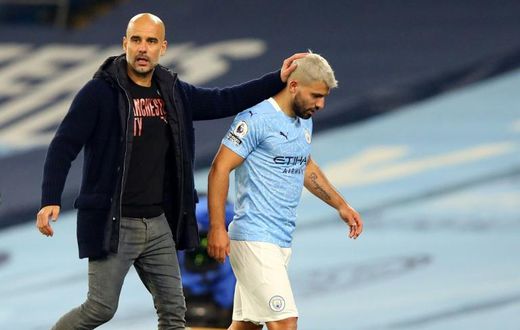 Manchester City striker Sergio Aguero (R) and his manager Pep Guardiola