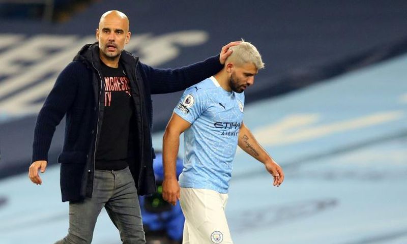 Manchester City striker Sergio Aguero (R) and his manager Pep Guardiola