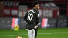 Manchester United forward Marcus Rashford takes a knee