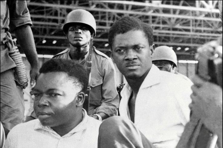 Downfall: Congolese independence hero Patrice Lumumba, right, and Joseph Okito, the vice president of the senate, pictured on their arrest in December 1960 in Leopoldville, now Kinshasa