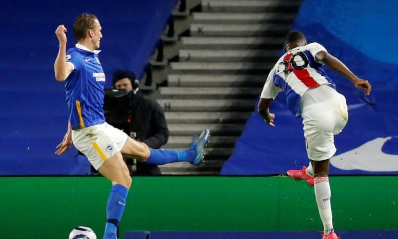 Benteke brilliance: Christian Benteke (right) snatched a 2-1 win for Crystal Palace away to Brighton on Monday