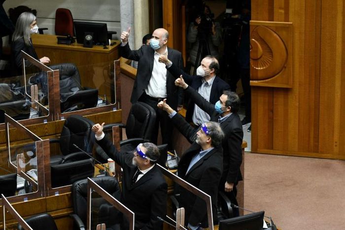 Senators in Chile give the thumbs up as they vote on pension reform