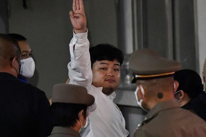 Several charges were read out against Parit Chiwarak before he was bundled into a waiting car