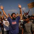 Clashes occurred near a new temporary camp built by Greek authorities where hundreds of migrants gathered to protest, some throwing stones at riot police who responded with tear gas.