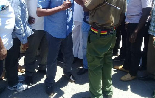 Former Machakos Senator Johnstone Muthama attempts to negotiate with police at Ukunda showground