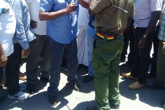 Former Machakos Senator Johnstone Muthama attempts to negotiate with police at Ukunda showground