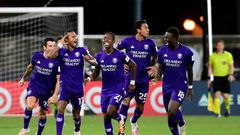 Orlando players celebrate after eliminating Los Angeles FC on penalties in the MLS restart competition