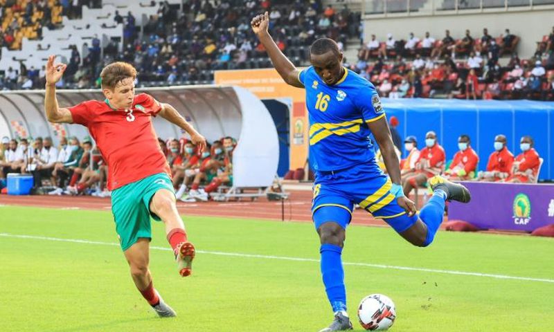 Abdelkarim Baadi (L) of Morocco attempts to block a cross by Ernest Sugira of Rwanda during  an African Nations Championship match in Douala Friday.