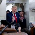 US President Donald Trump speaks with reporters aboard Air Force One on August 28, 2020