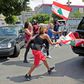 Lebanese protesters make an abortive attempt to disupt a session of parliament at which it backed the emergency powers assumed by the government