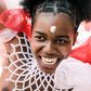 Adorned in colourful beads, a young woman is pictured in 2019 dancing before the Zulu king holding a long reed