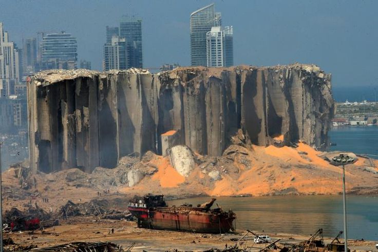 The damaged grain silo and a burnt ship at Beirut's harbour after a powerful explosion tore through Lebanon's capital