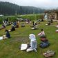 Students attend an open-air school in a highland meadow in in Doodhpathri, Indian-administered Kashmir