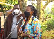 Actress, radio presenter Jacqueline Nyaminde "Wilbroda" addresses mourners during the burial of Charles Bukeko alias "Papa Shirandula"