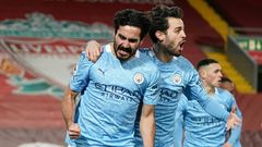 Ilkay Gundogan (left) scored twice at Anfield as Manchester City beat Liverpool 4-1