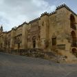 A lone tourist walks around The Mezquita in Cordova, one of Spain's interior cities that is being disproportionately hit by the drop in tourism