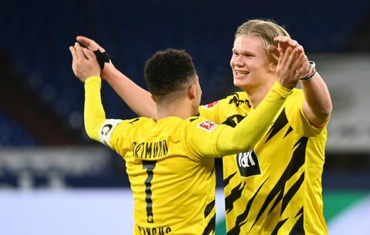 Striker Erling Braut Haaland (R) and England winger Jadon Sancho both scored in Dortmund's derby win on Saturday