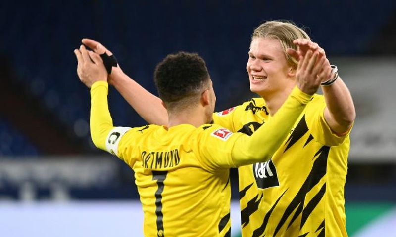 Striker Erling Braut Haaland (R) and England winger Jadon Sancho both scored in Dortmund's derby win on Saturday
