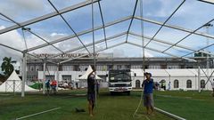Workers building temporary shelters for coronavirus patients on a football pitch in Yangon, where new infections have spiked prompting opposition parties to call for a postponement of elections due in November