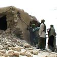A still from a video shows jihadists destroying an ancient shrine in Timbuktu in 2012