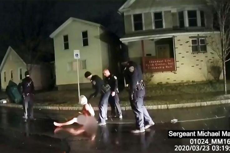 This image taken from police bodycam video released by the Rochester, New York, Police Department, shows police arresting Daniel Prude on March 23, 2020 after putting a hood on his head