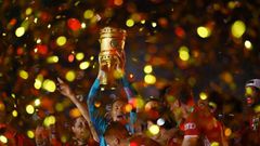 Manuel Neuer raises the German Cup trophy after Bayern Munich beat Bayer Leverkusen in last season's final in July