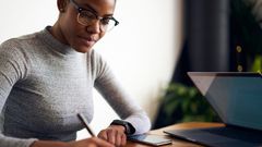 woman writing desk working