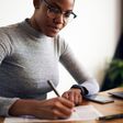 woman writing desk working