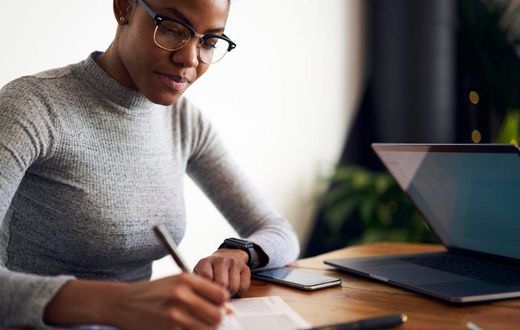 woman writing desk working