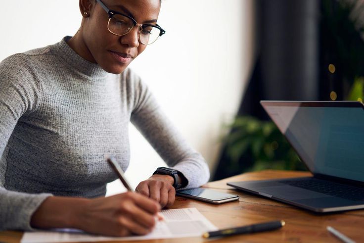 woman writing desk working