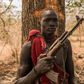 A young herdsman from the Dinka tribe poses with a semi-automatic weapon. Guns are rife in rural South Sudan, for self-protection or defence against cattle raiders