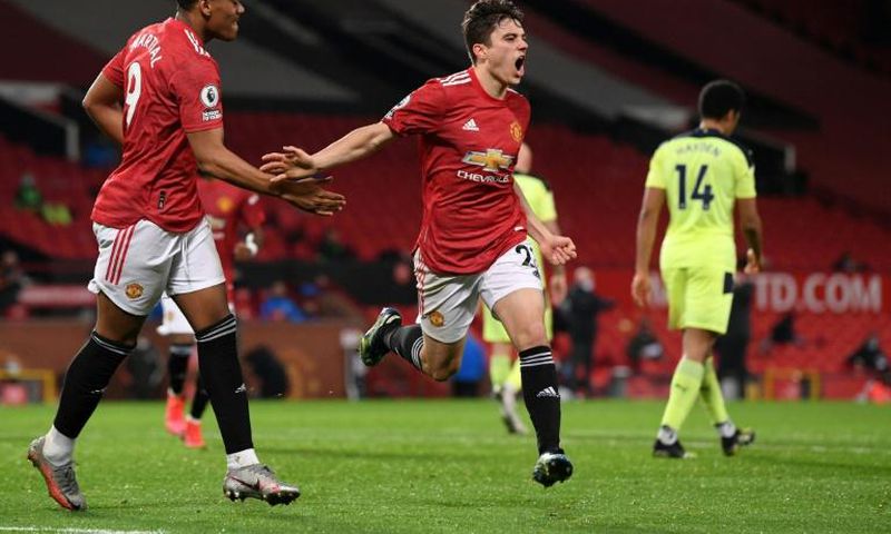 Dan the man: Daniel James (centre)celebrates scoring Manchester United's second goal