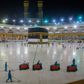 A handout picture from the Saudi Ministry of Media shows workers cleaning while some pilgrims pray in front of the Kaaba, Islam's holiest shrine, at the Grand Mosque complex in Saudi Arabia's holy city of Mecca during the annual hajj pilgrimage