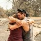 Resident Austin Giannuzzi cries while embracing family members at the burned remains of their home during the LNU Lightning Complex fire in Vacaville, California on August 23, 2020